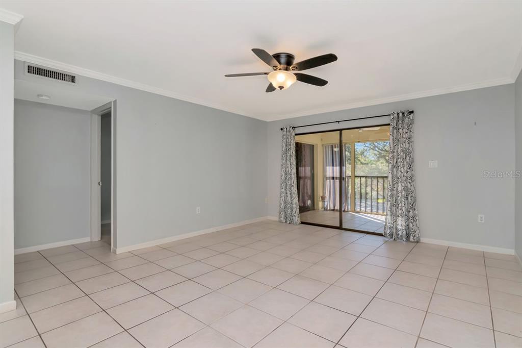 2650 Countryside Boulevard, Unit F303 Clearwater, FL 33761 - Photo 26 of 39 a view of an empty room with a window