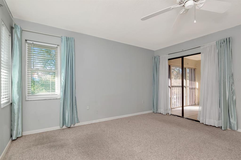 2650 Countryside Boulevard, Unit F303 Clearwater, FL 33761 - Photo 30 of 39 an empty room with windows and closet