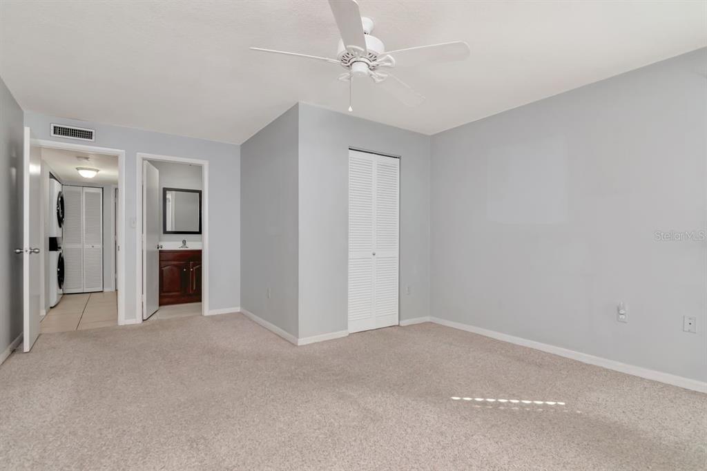 2650 Countryside Boulevard, Unit F303 Clearwater, FL 33761 - Photo 31 of 39 a view of empty room with a ceiling fan