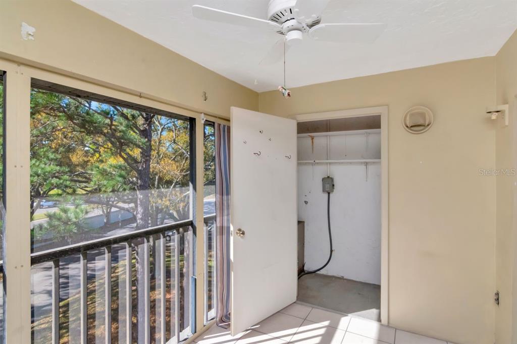 2650 Countryside Boulevard, Unit F303 Clearwater, FL 33761 - Photo 39 of 39 a bathroom with a glass shower door and a glass door