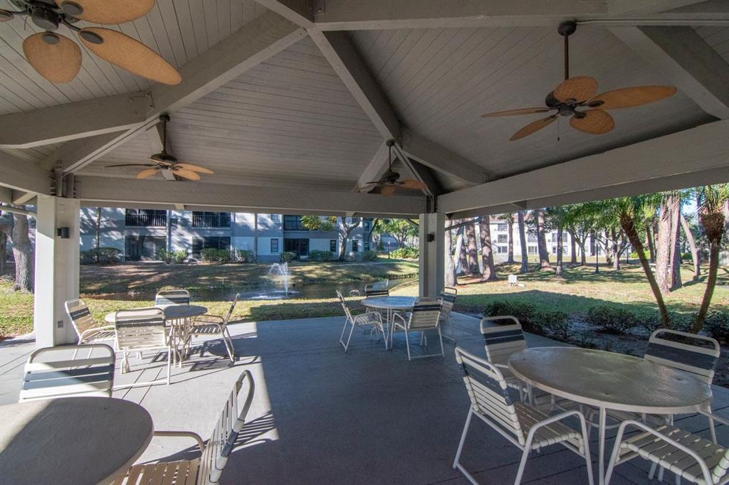 2650 Countryside Boulevard, Unit F303 Clearwater, FL 33761 - Photo 4 of 39 a dining room with furniture window and outside view