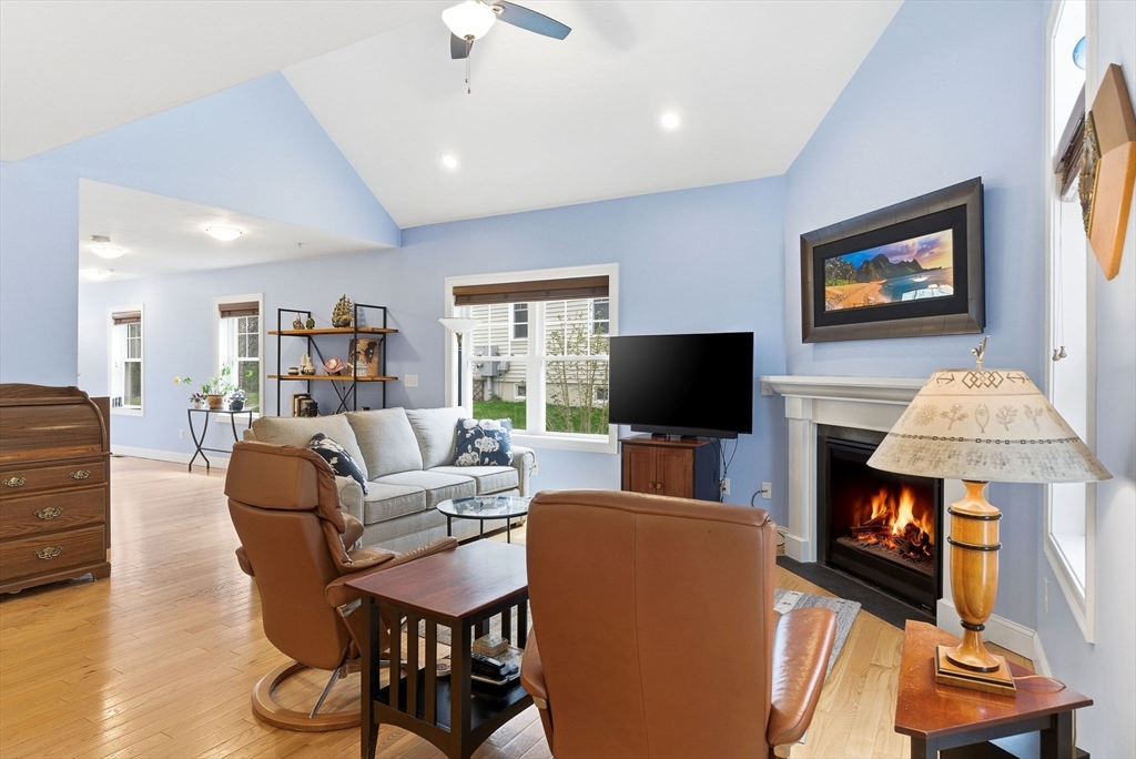 6 Trail Ridge Way, Unit D Harvard, MA 01451 - Photo 11 of 28 a living room with furniture and a flat screen tv