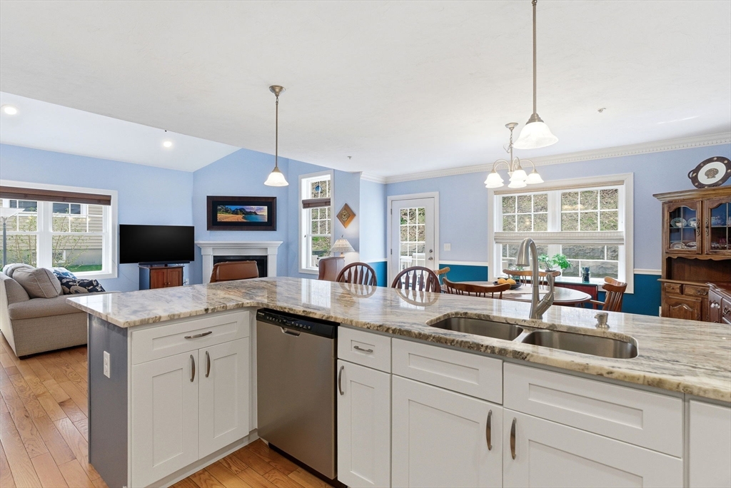 6 Trail Ridge Way, Unit D Harvard, MA 01451 - Photo 13 of 28 a kitchen with sink stove and cabinets