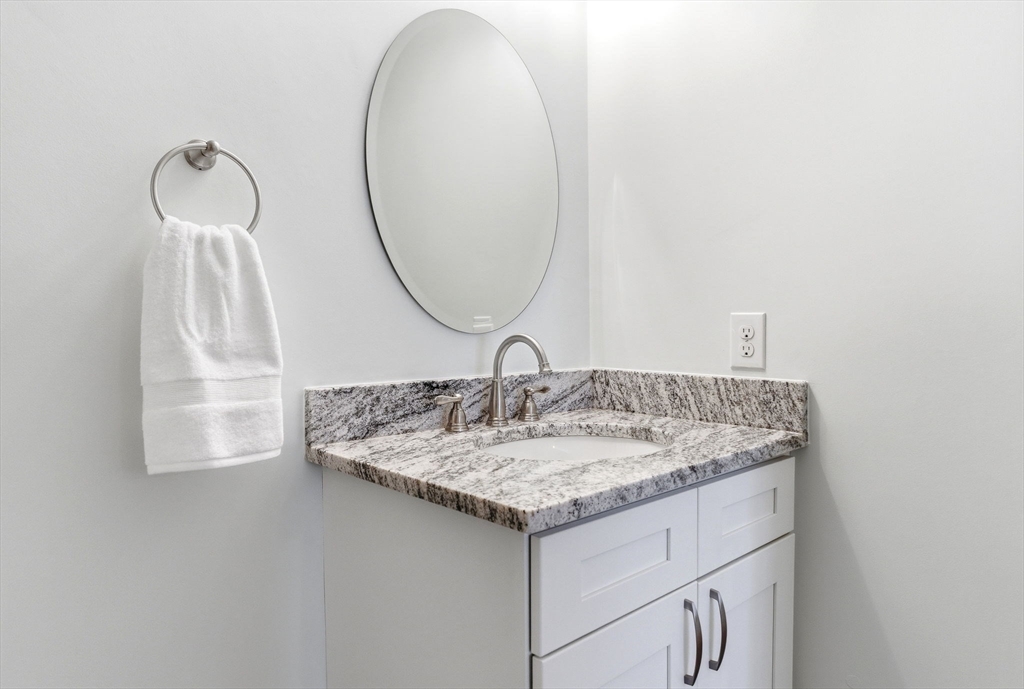 6 Trail Ridge Way, Unit D Harvard, MA 01451 - Photo 18 of 28 a bathroom with a sink and a mirror