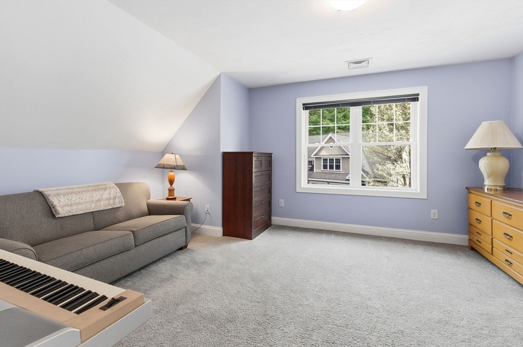 6 Trail Ridge Way, Unit D Harvard, MA 01451 - Photo 19 of 28 a living room with furniture and a window