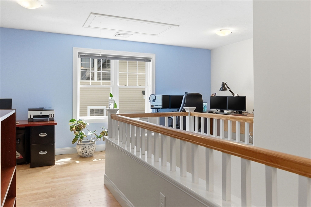 6 Trail Ridge Way, Unit D Harvard, MA 01451 - Photo 21 of 28 a living room with furniture and wooden floor