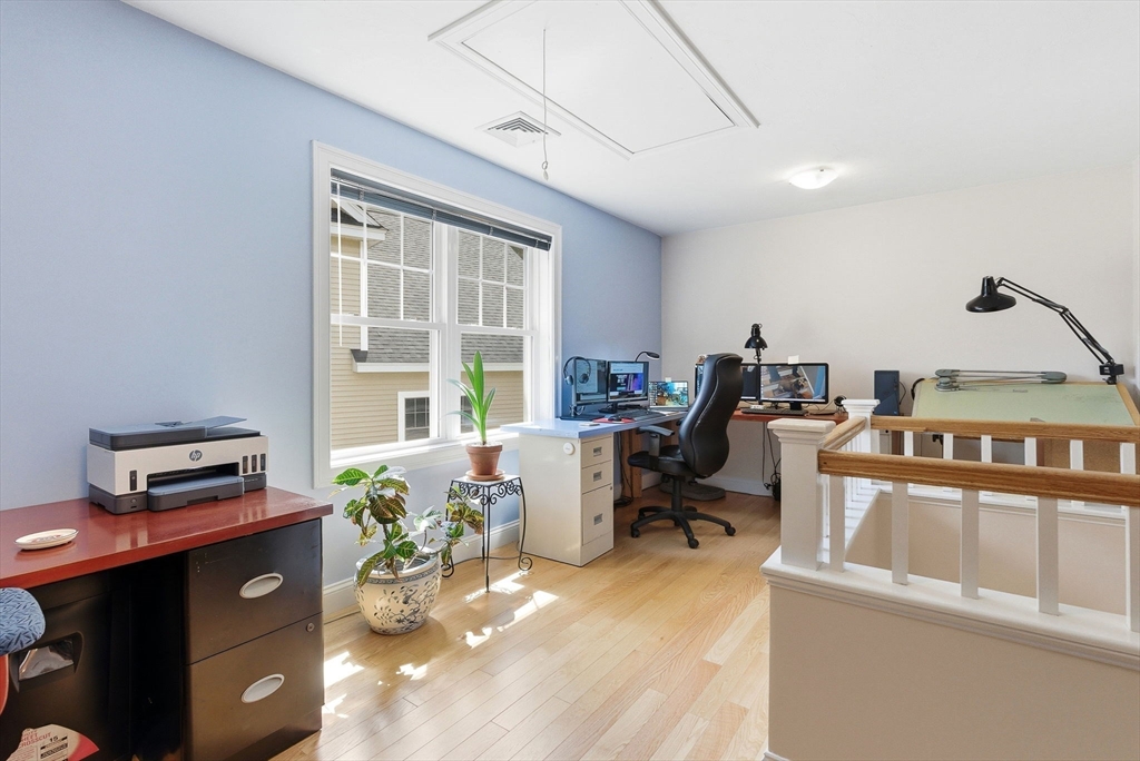 6 Trail Ridge Way, Unit D Harvard, MA 01451 - Photo 22 of 28 a work room with furniture a bookshelf and a window