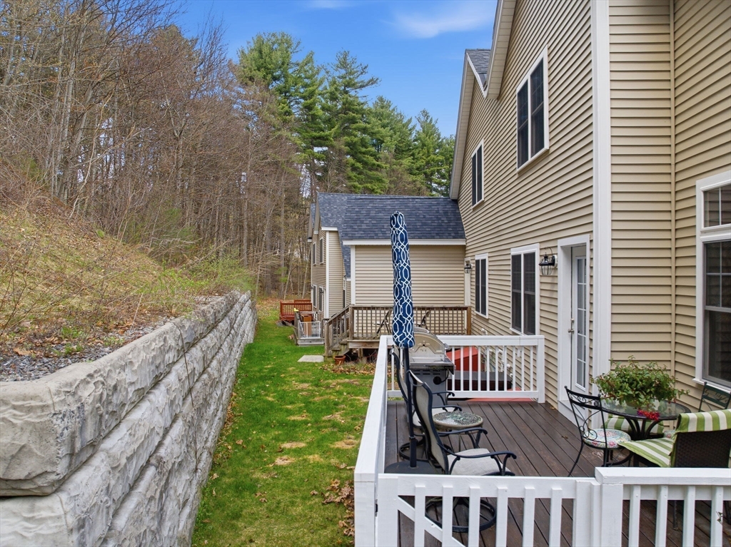 6 Trail Ridge Way, Unit D Harvard, MA 01451 - Photo 6 of 28 a view of a house with backyard and porch