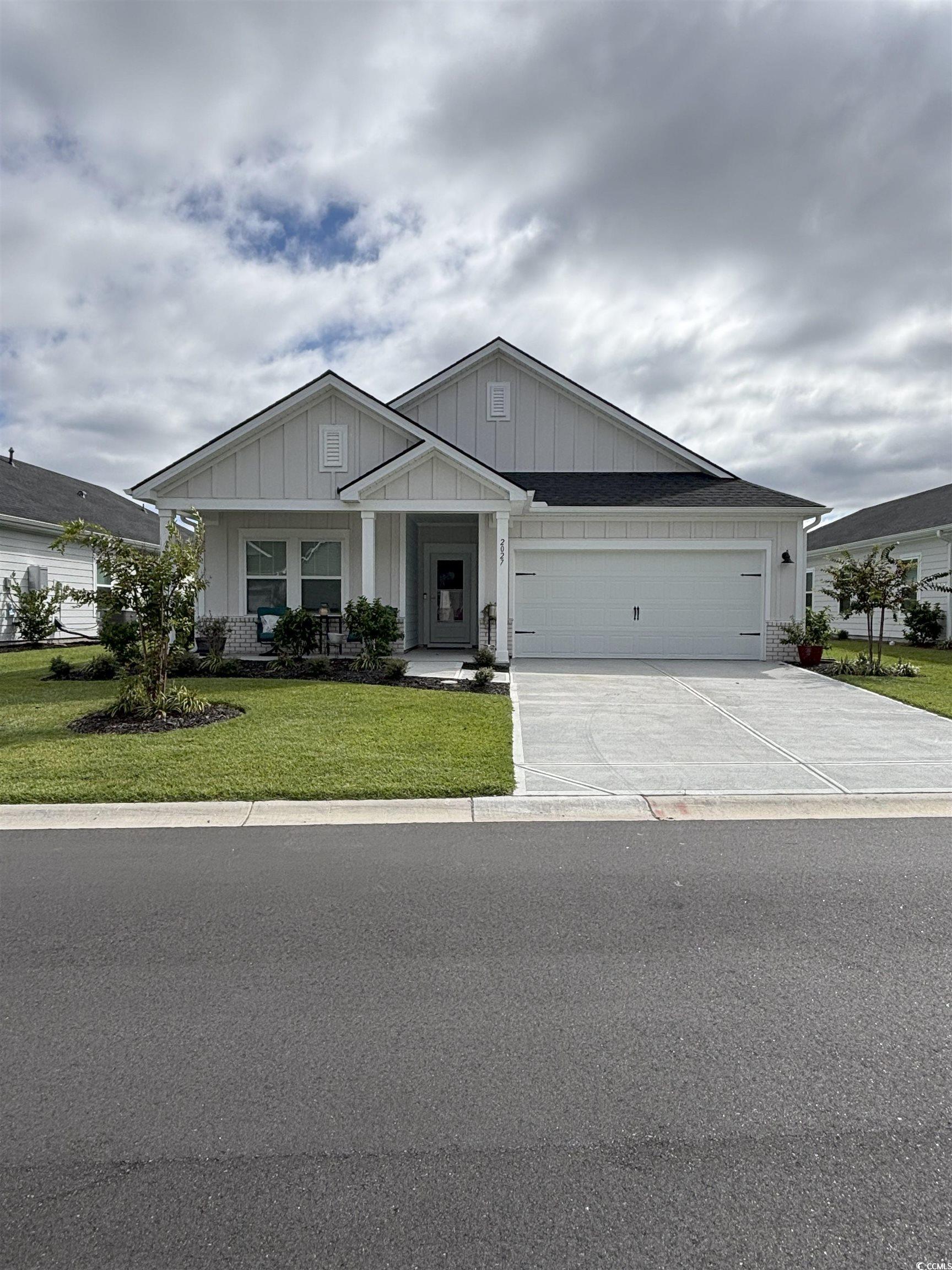 2027 Copper Crk Loop Longs, SC 29568 - Photo 1 of 17 Craftsman inspired home featuring board and batten