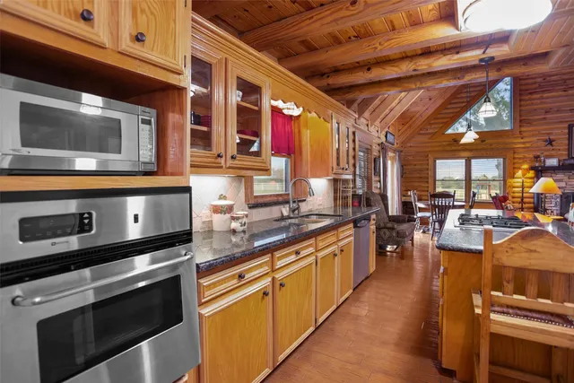 a spacious bedroom with a bed and a couch