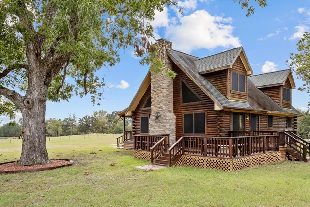 a view of a balcony with wooden floor and ocean view