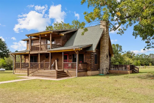 a view of house with a swimming pool
