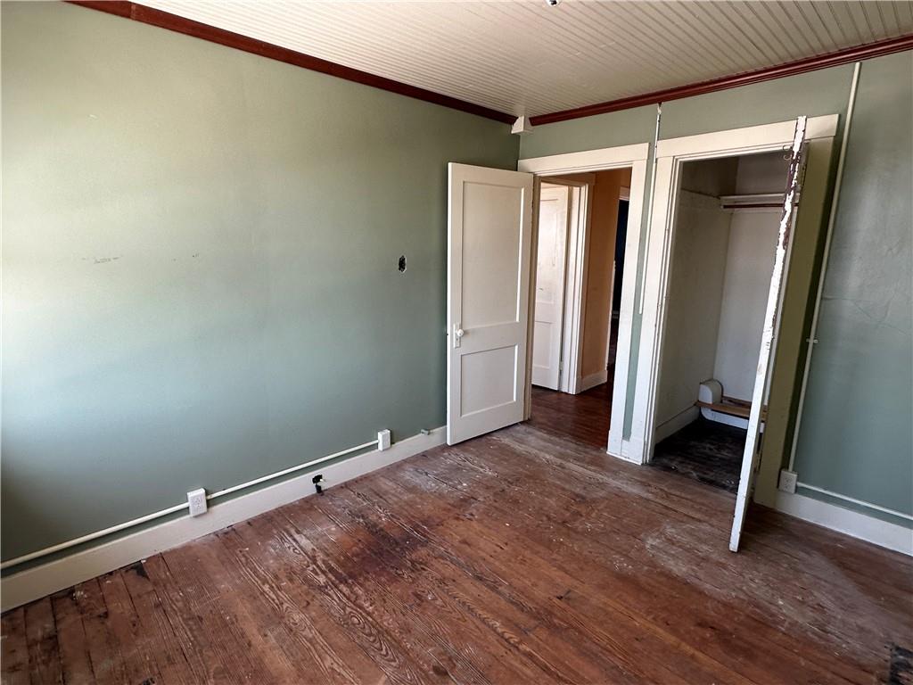 3733 Superior Street Homestead, PA 15120 - Photo 14 of 16 a view of an empty room with wooden floor and a window