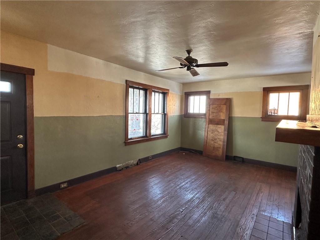 3733 Superior Street Homestead, PA 15120 - Photo 4 of 16 a view of an empty room with a window and wooden floor