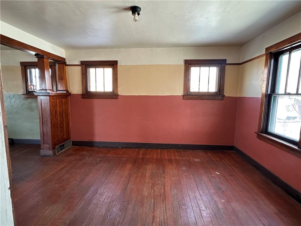 3733 Superior Street Homestead, PA 15120 - Photo 6 of 16 an empty room with wooden floor and windows