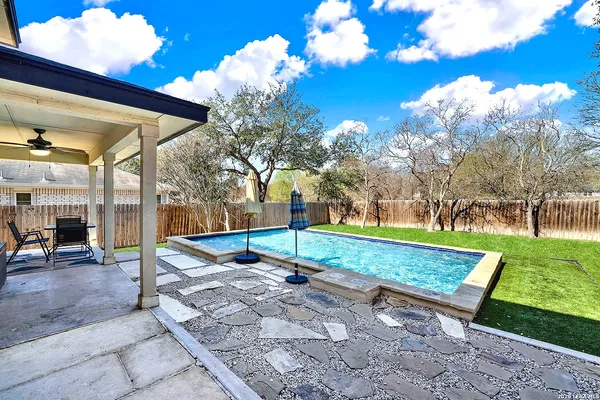 a view of a park with large trees