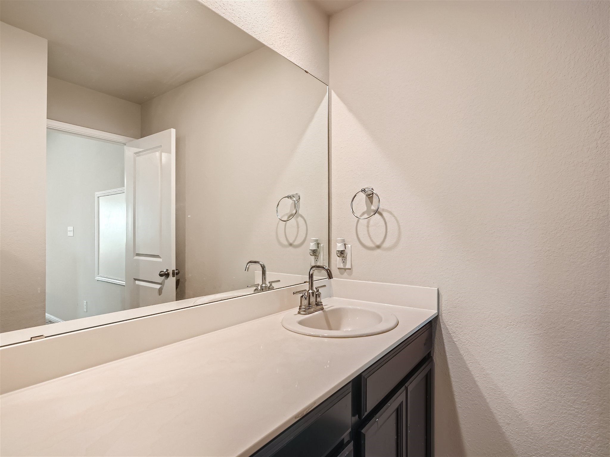 1416 Deering Run Leander, TX 78641 - Photo 15 of 21 a bathroom with a sink and a mirror