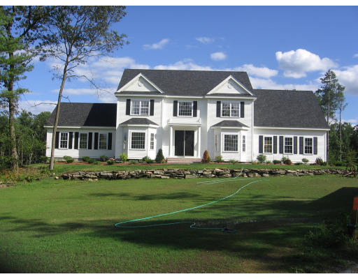 1165 Hill Road Boxborough, MA 01719 - Photo 1 of 10 a front view of a house with a garden