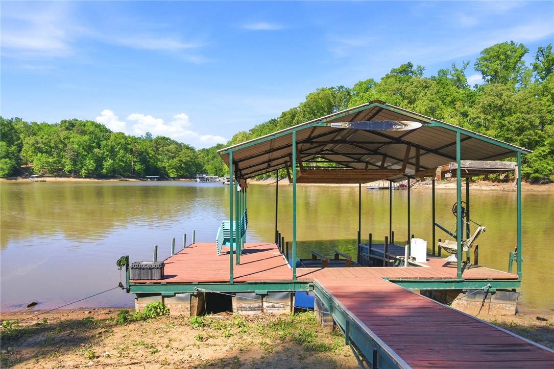 110 Snug Harbor Road Seneca, SC 29678 - Photo 32 of 37 Enjoy direct lake access with this property, featuring a private covered boat dock and serene waterfront views.