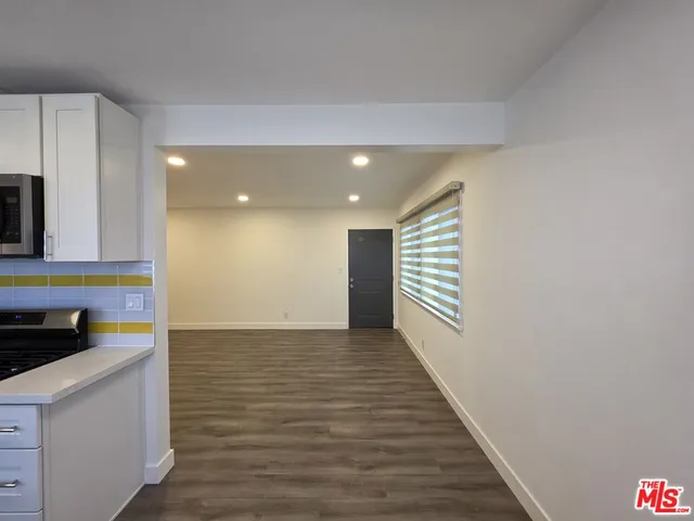 a view of a kitchen from the hallway