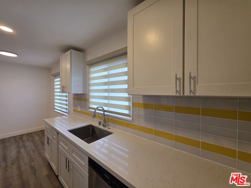 707 Strand Street, Unit 3 Santa Monica, CA 90405 - Photo 21 of 42 a kitchen with stainless steel appliances a sink and a stove