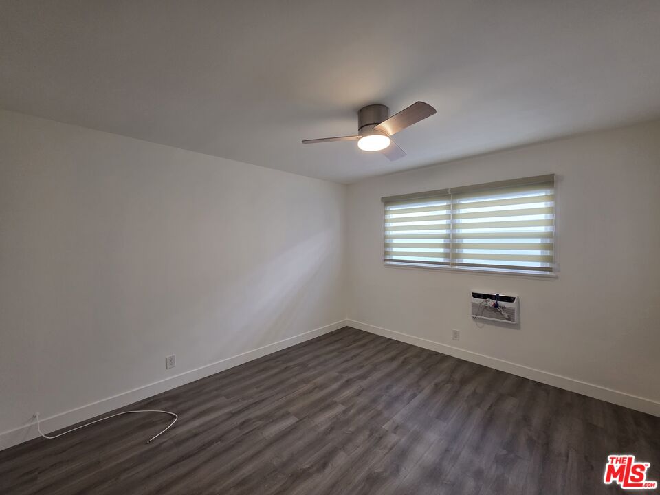 707 Strand Street, Unit 3 Santa Monica, CA 90405 - Photo 28 of 42 wooden floor in an empty room with a window