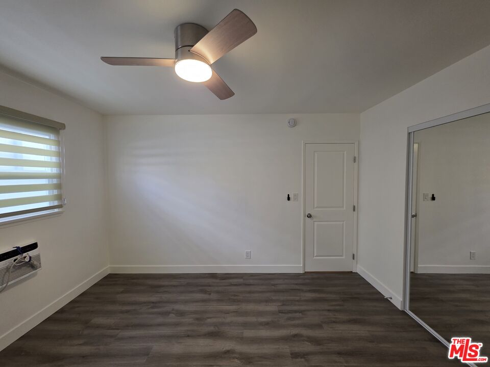 707 Strand Street, Unit 3 Santa Monica, CA 90405 - Photo 31 of 42 a view of an empty room with wooden floor and a window