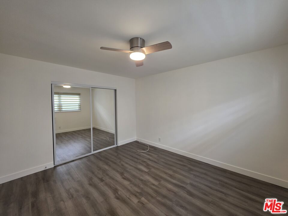 707 Strand Street, Unit 3 Santa Monica, CA 90405 - Photo 34 of 42 wooden floor in an empty room with a window