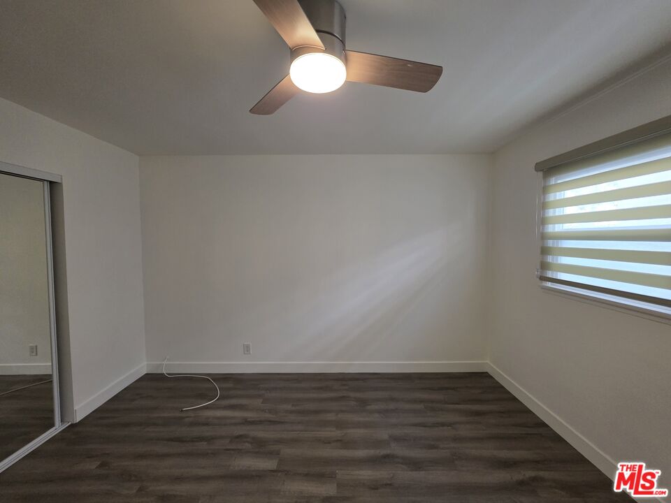 707 Strand Street, Unit 3 Santa Monica, CA 90405 - Photo 35 of 42 a view of an empty room with wooden floor and a window