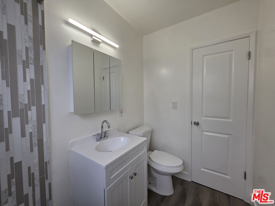 707 Strand Street, Unit 3 Santa Monica, CA 90405 - Photo 39 of 42 a bathroom with a sink toilet a vanity and shower