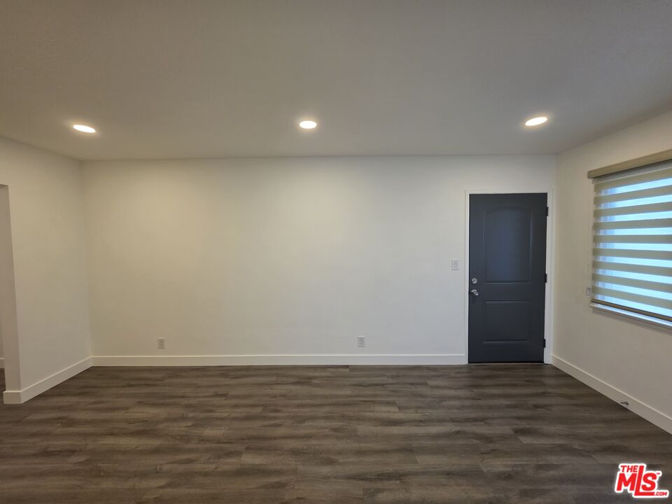 707 Strand Street, Unit 3 Santa Monica, CA 90405 - Photo 4 of 42 a view of room with window and wooden floor
