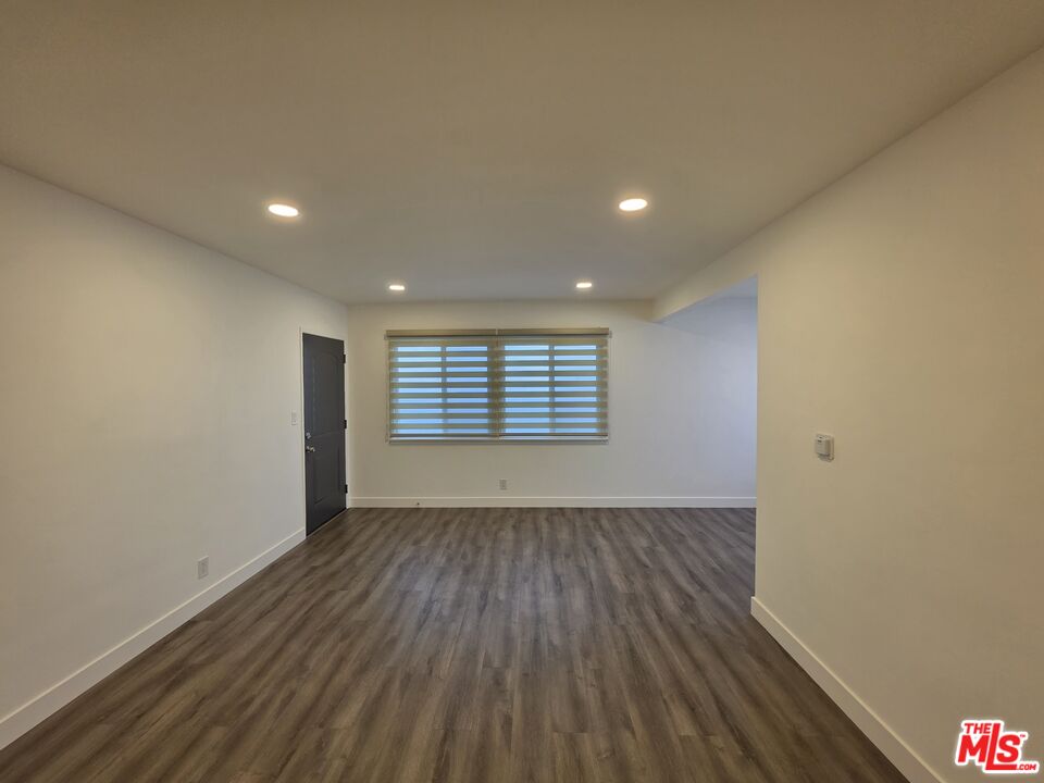 707 Strand Street, Unit 3 Santa Monica, CA 90405 - Photo 6 of 42 an empty room with wooden floor and windows