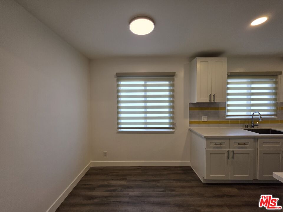 707 Strand Street, Unit 3 Santa Monica, CA 90405 - Photo 10 of 42 a view of a room with a sink cabinets and wooden floor