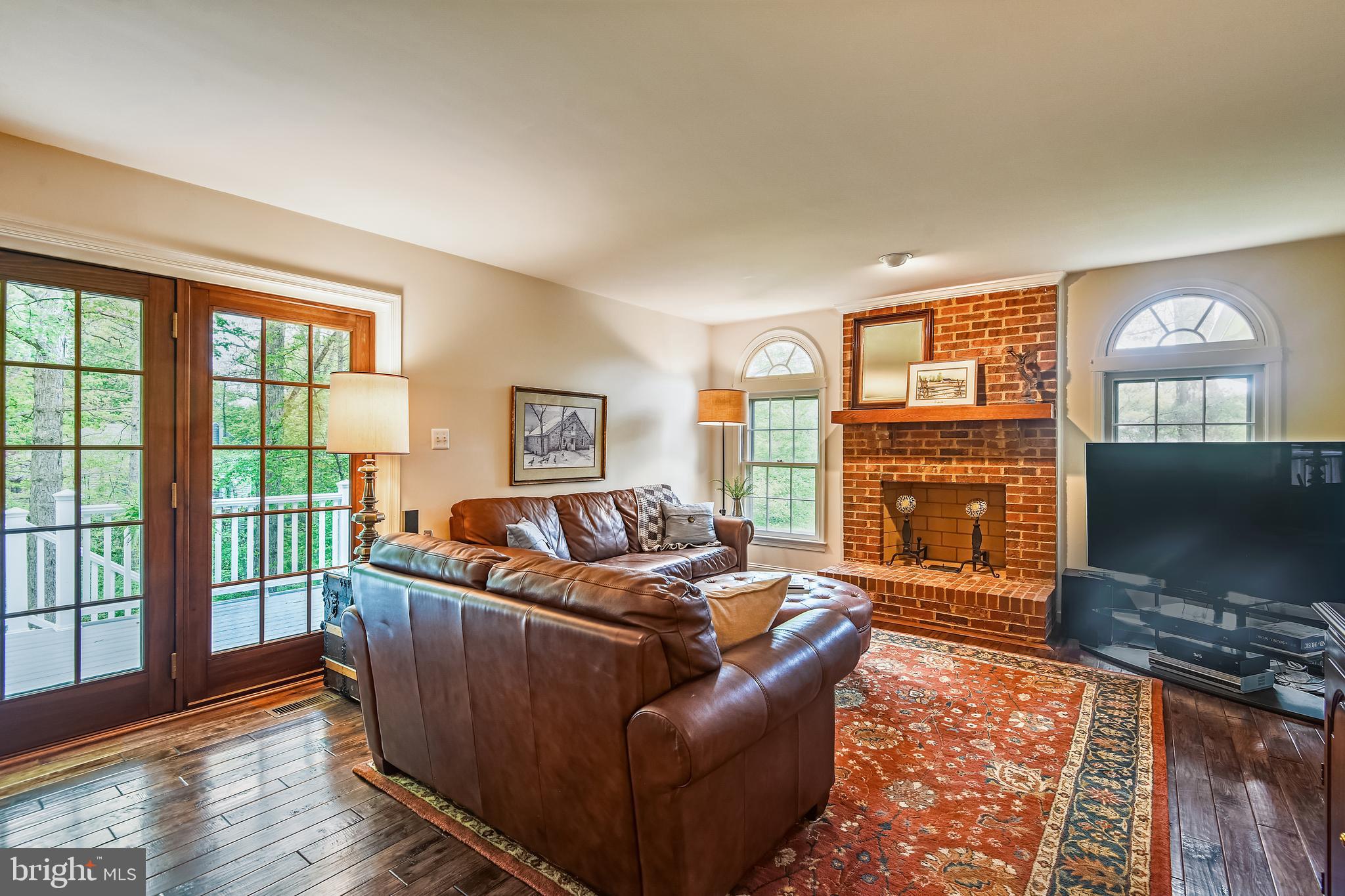 11949 Grey Squirrel Lane Reston, VA 20194 - Photo 10 of 65 Fam. room fpl flanked by windows