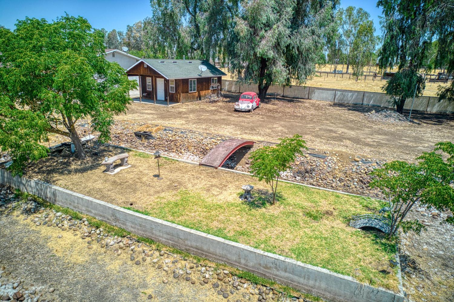 5578 Perrin Road Clovis, CA 93619 - Photo 11 of 62 a view of a backyard with a garden and plants