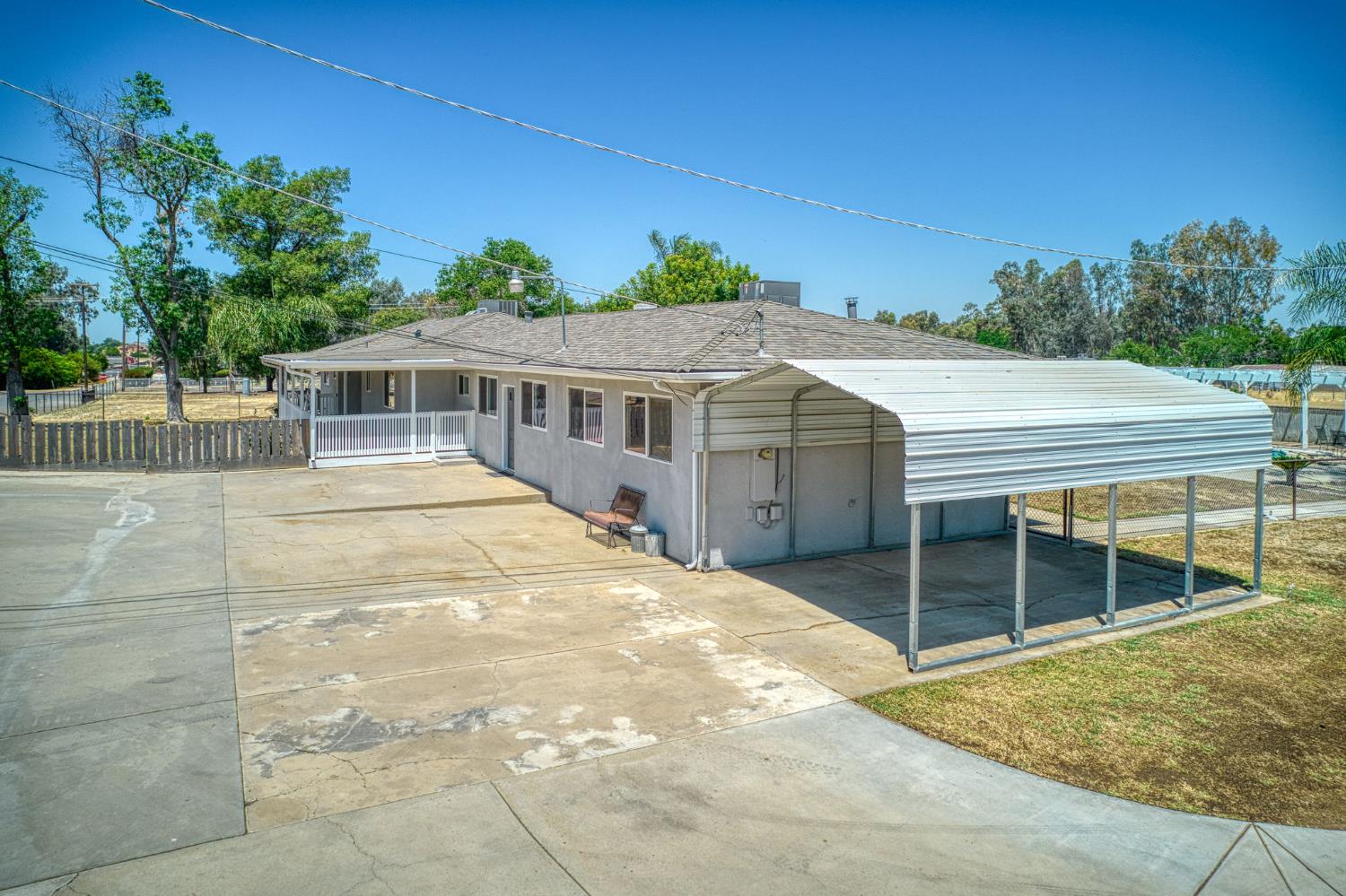 5578 Perrin Road Clovis, CA 93619 - Photo 13 of 62 a view of a house with a backyard
