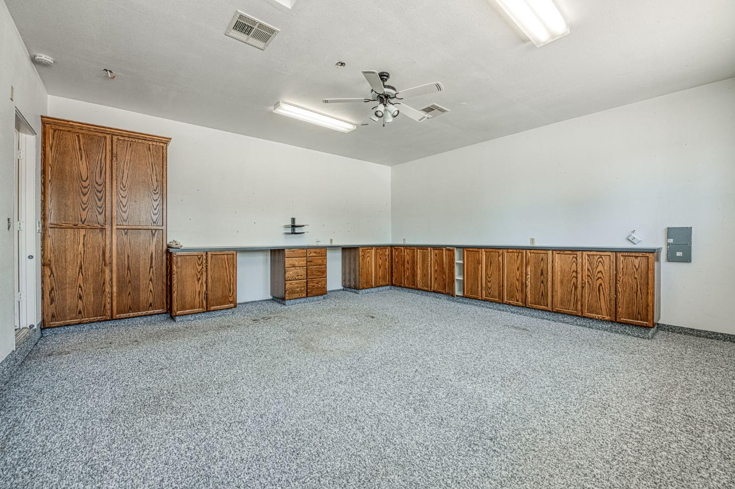 5578 Perrin Road Clovis, CA 93619 - Photo 17 of 62 an empty room with chandelier fan and windows