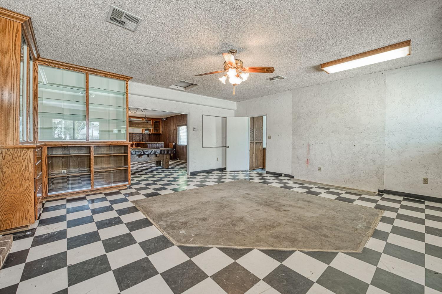 5578 Perrin Road Clovis, CA 93619 - Photo 18 of 62 a view of a livingroom with a black and white checkered floor
