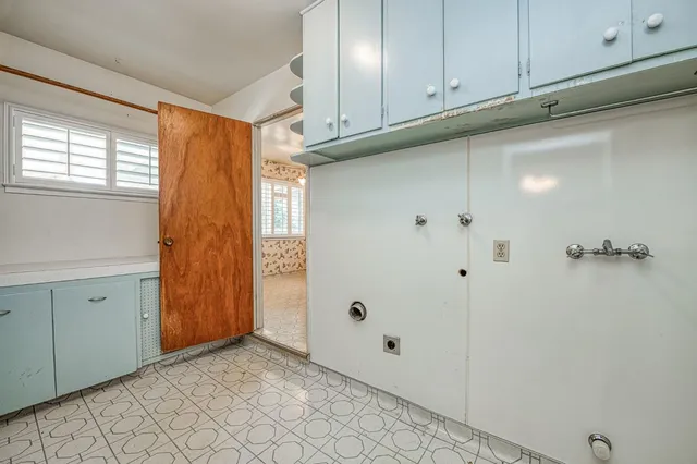 a kitchen with a stove a sink and a refrigerator