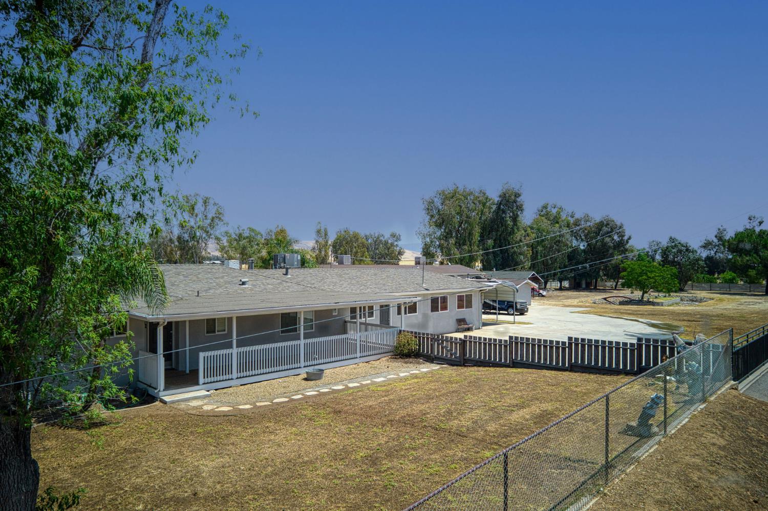 5578 Perrin Road Clovis, CA 93619 - Photo 3 of 62 a view of a house with outdoor space and sitting area