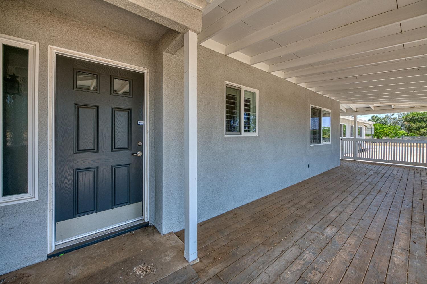 5578 Perrin Road Clovis, CA 93619 - Photo 4 of 62 an empty room with wooden floor and windows
