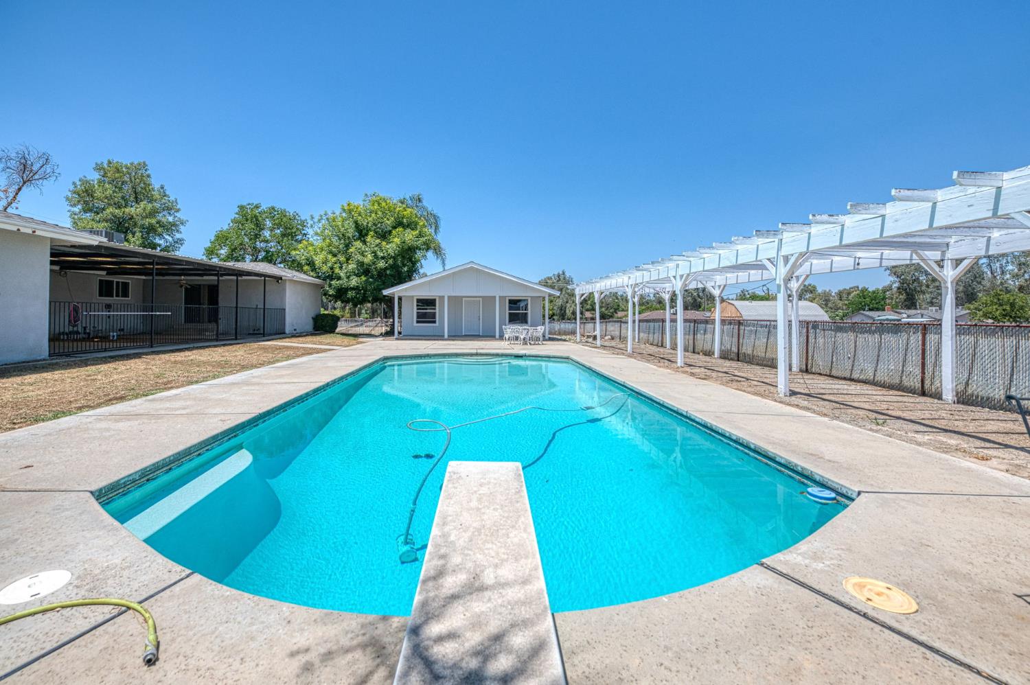 5578 Perrin Road Clovis, CA 93619 - Photo 45 of 62 a view of a swimming pool with a patio