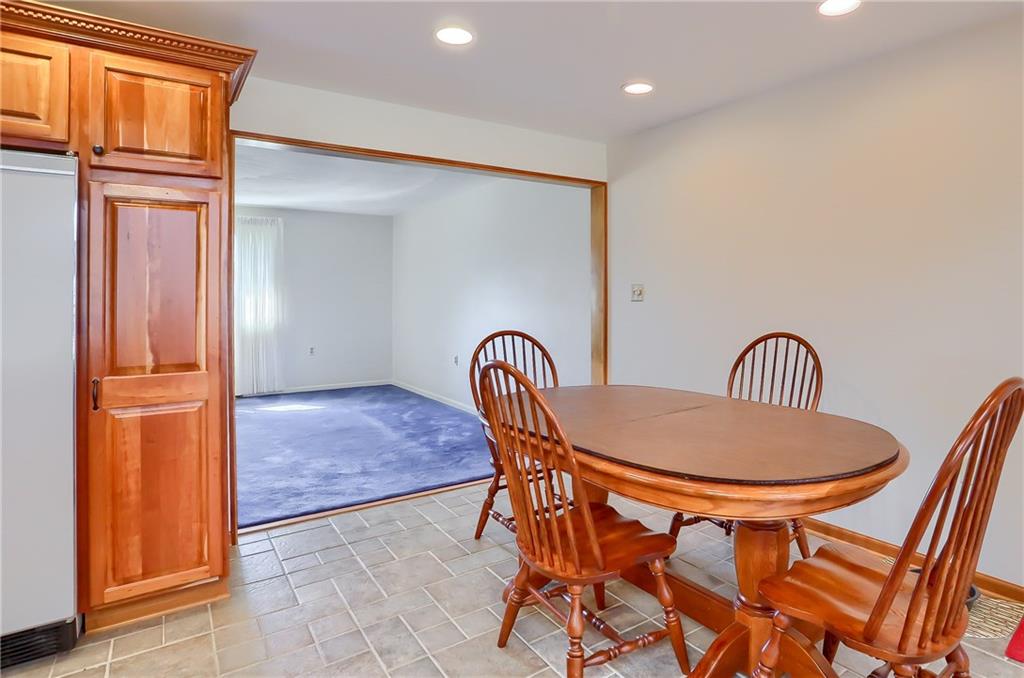 3912 Shepard Road Gibsonia, PA 15044 - Photo 11 of 25 Main floor eating nook, from this vantage point, you can see your formal living room, or spectacular family room including the wall of windows.