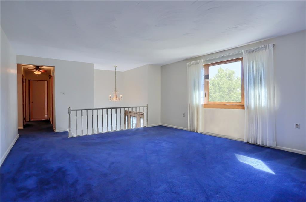 3912 Shepard Road Gibsonia, PA 15044 - Photo 14 of 25 Main floor formal living room, hallway leads to the 3 main level bedrooms and full bath.