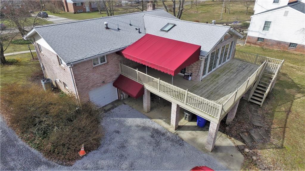 3912 Shepard Road Gibsonia, PA 15044 - Photo 3 of 25 This photo shows you the expansive addition, and deck, which overlooks the 1-acre flat lot. Privacy and wild-life is what you'll experience when you sit back and relax on your lovely deck.