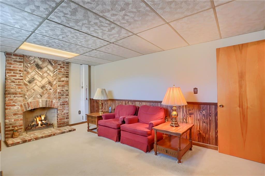 3912 Shepard Road Gibsonia, PA 15044 - Photo 22 of 25 Lower level finished game room complete with beautiful log burning fireplace!