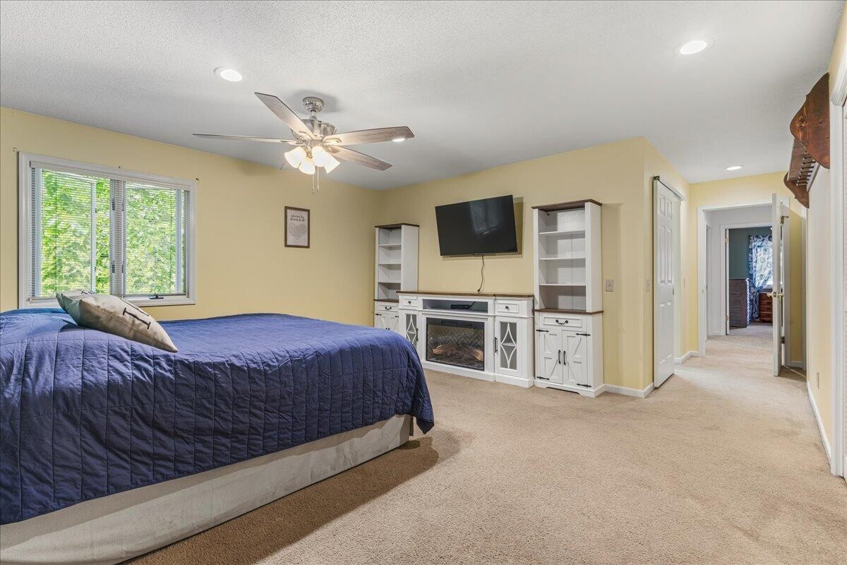 2522 Cindy Street Athens, TN 37303 - Photo 26 of 36 a spacious bedroom with a bed and a flat screen tv