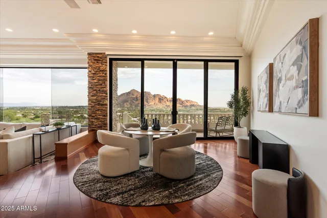 a bedroom with a large window and a bed