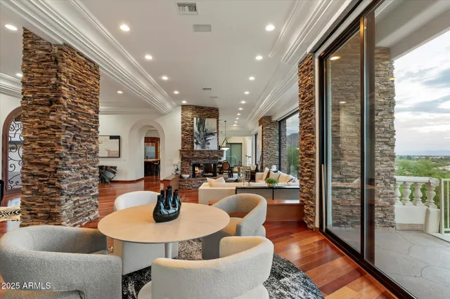 a view of a livingroom with furniture window and a floor to ceiling window