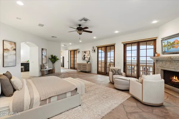 a living room with furniture large window and a table